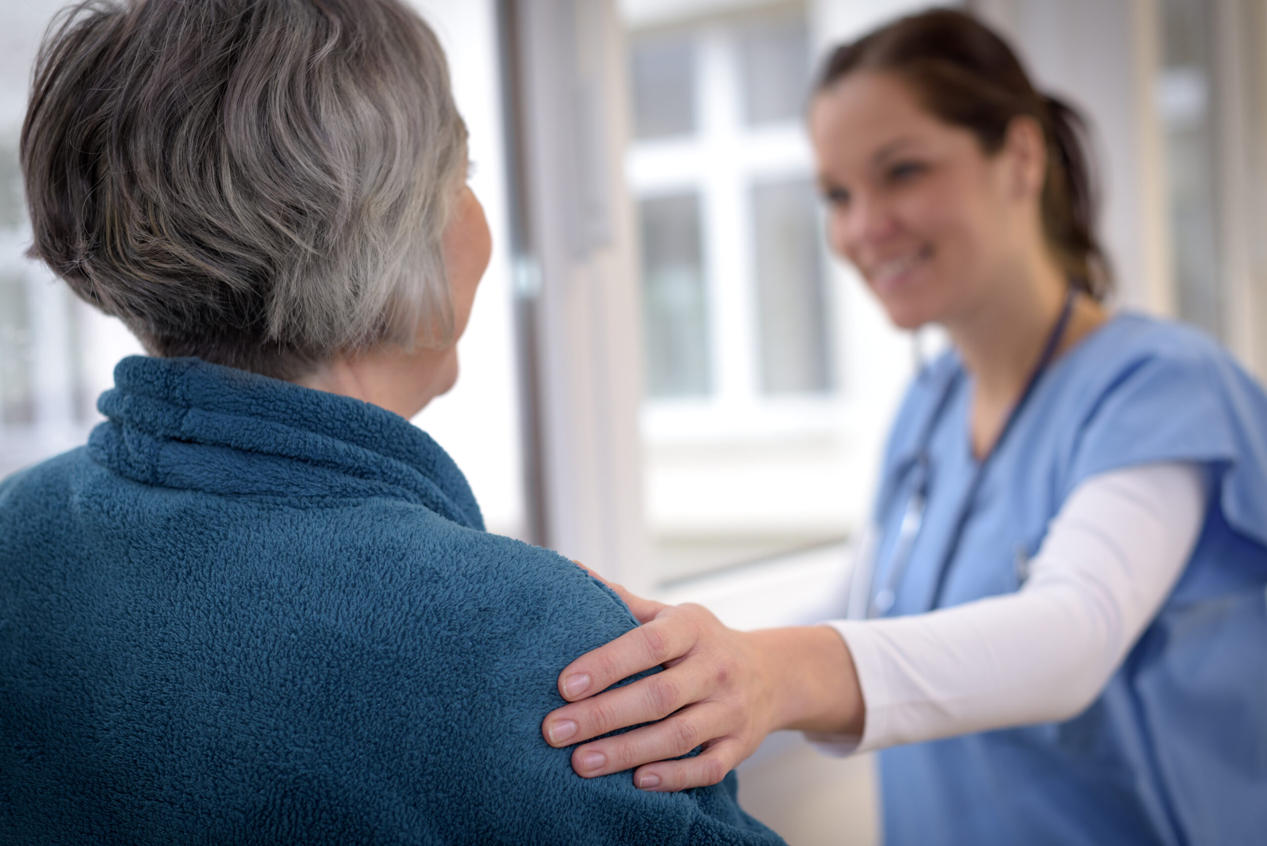 medical worker caring for senior adult