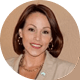 Dene Margiotta smiling in a tan blazer