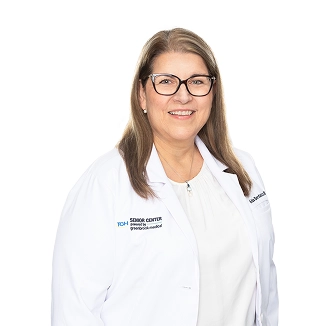 Dr. Michelle Danyluk, a physician at the Senior Center, wearing a white lab coat
